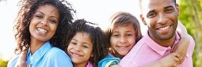 Family dentistry patients smiling in Norfolk MA