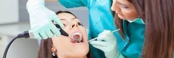 Woman receiving periodontal treatment in Norfolk MA