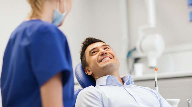 A man smiling at his dentist | Norfolk dentist