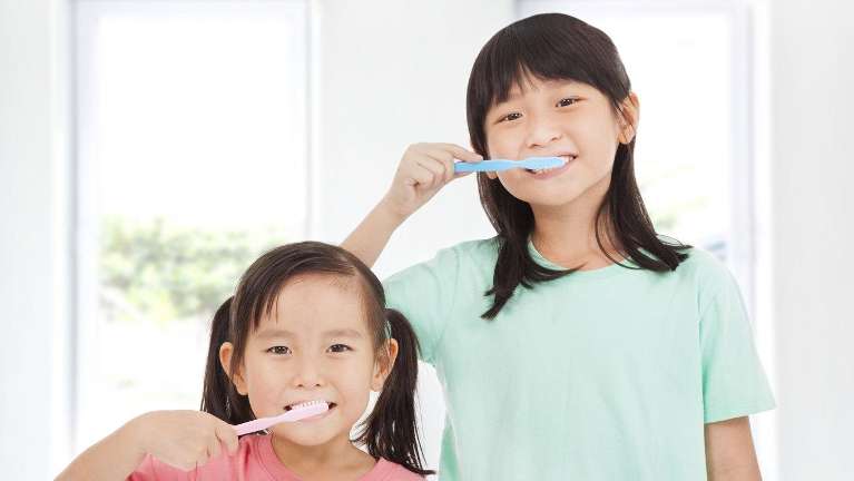 children brushing teeth at Norfolk County Dental Care