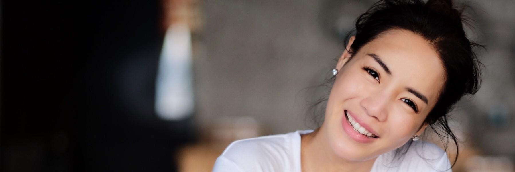 Woman with dental veneers smiling near Norfolk MA