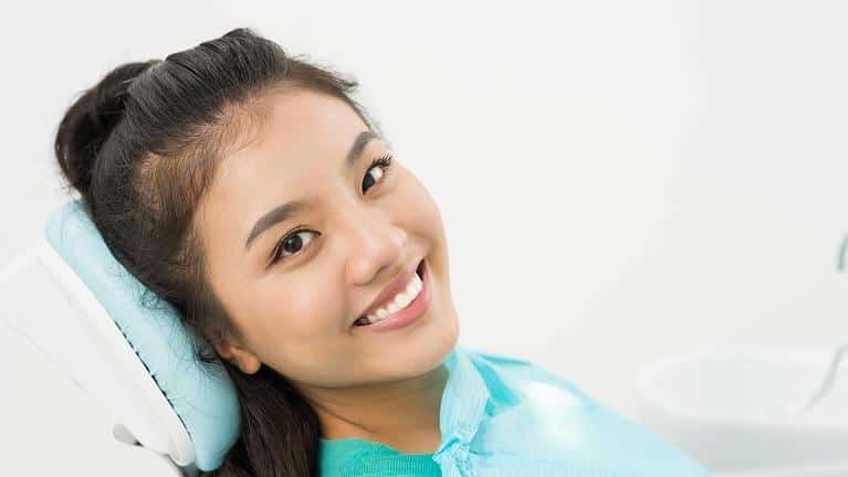 Patient smiling at dentist in Norfolk MA