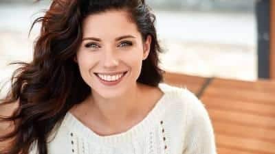 Woman smiling at cosmetic dentist near me Norfolk, MA