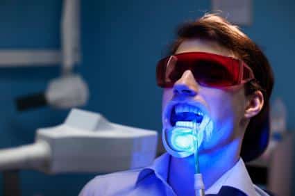 Dental patient during teeth whitening treatment in Norfolk MA